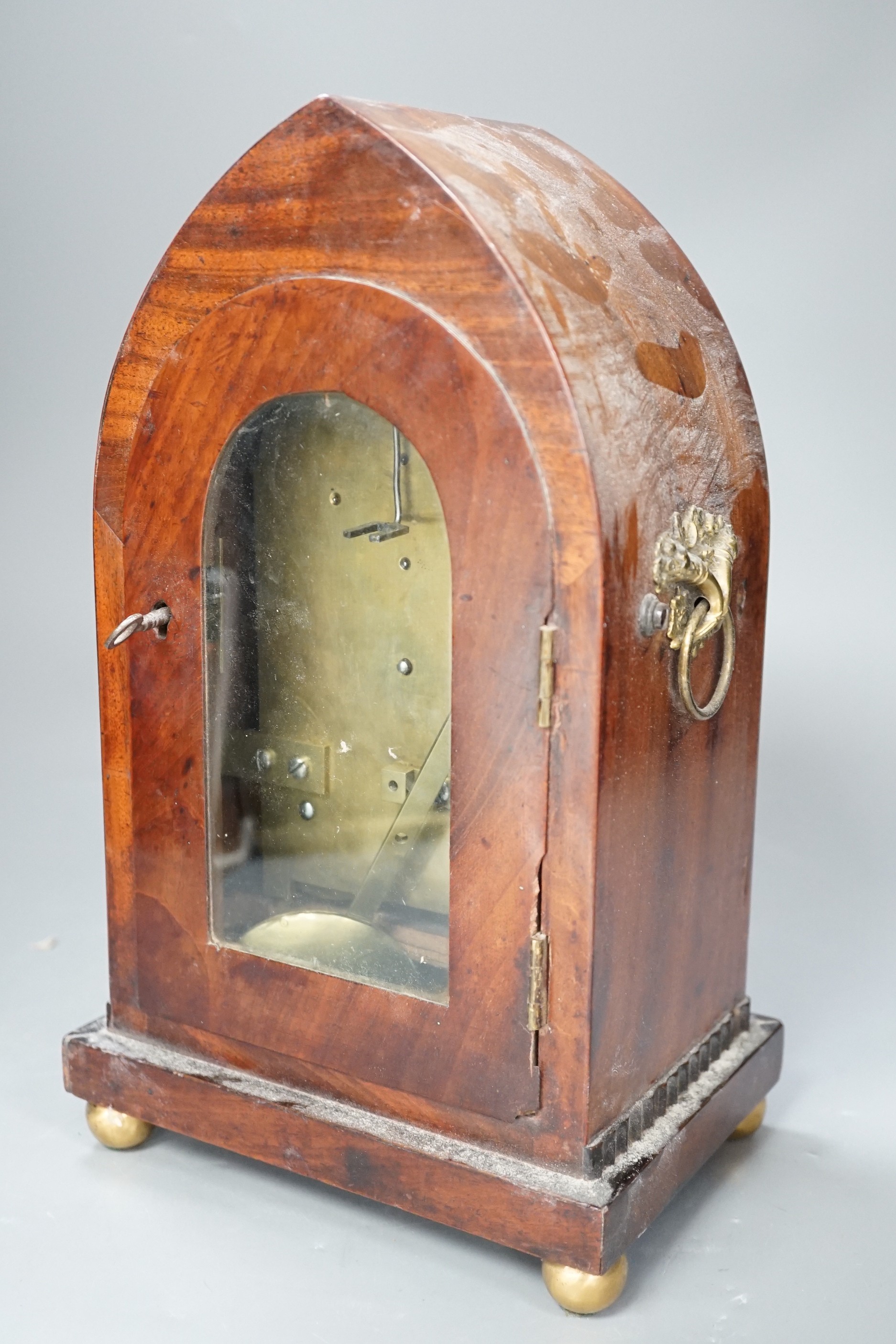 A Clements of Oxford brass inset mahogany lancet timepiece, with pendulum. 30cm high